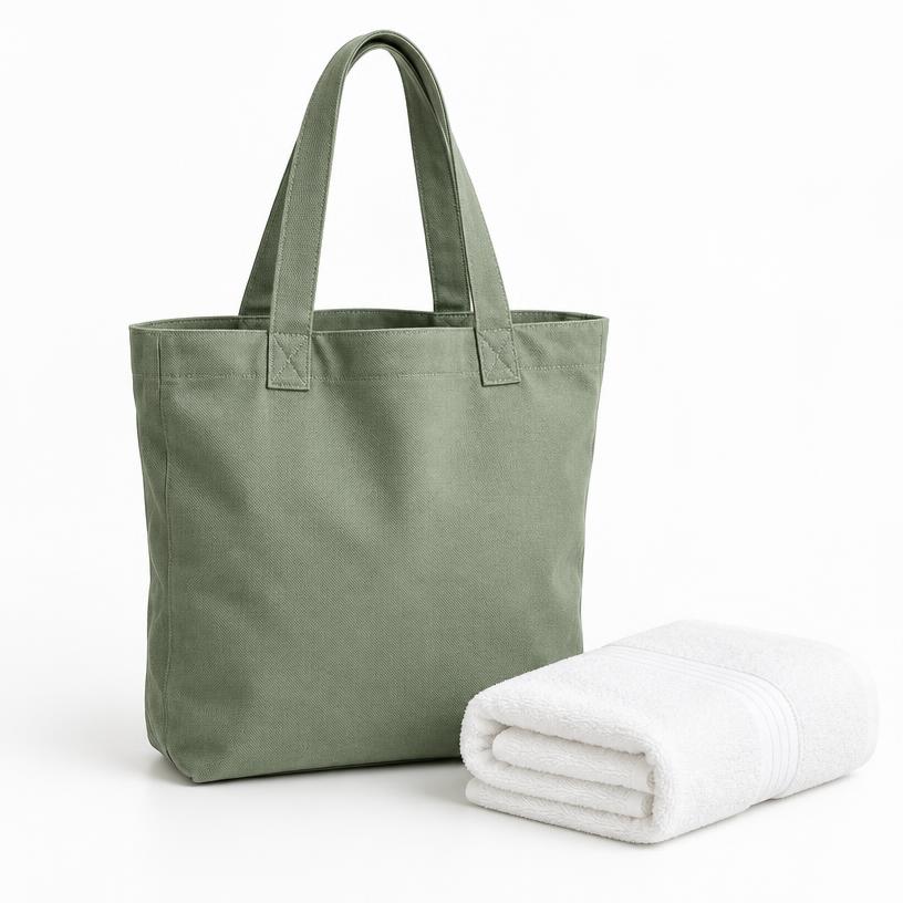 Sage canvas tote and cotton towel in an illustrative storefront